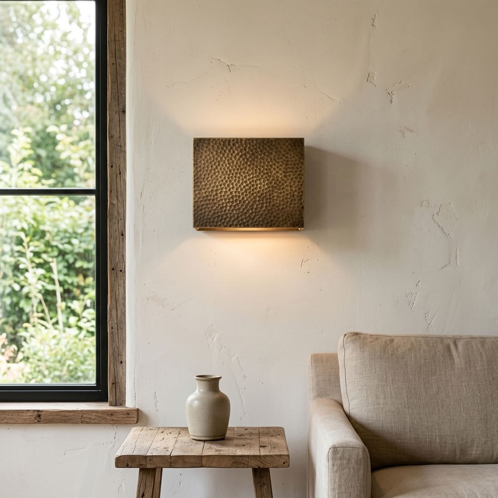 Hammered brass square wall sconce with soft indirect ambient lighting — view 1