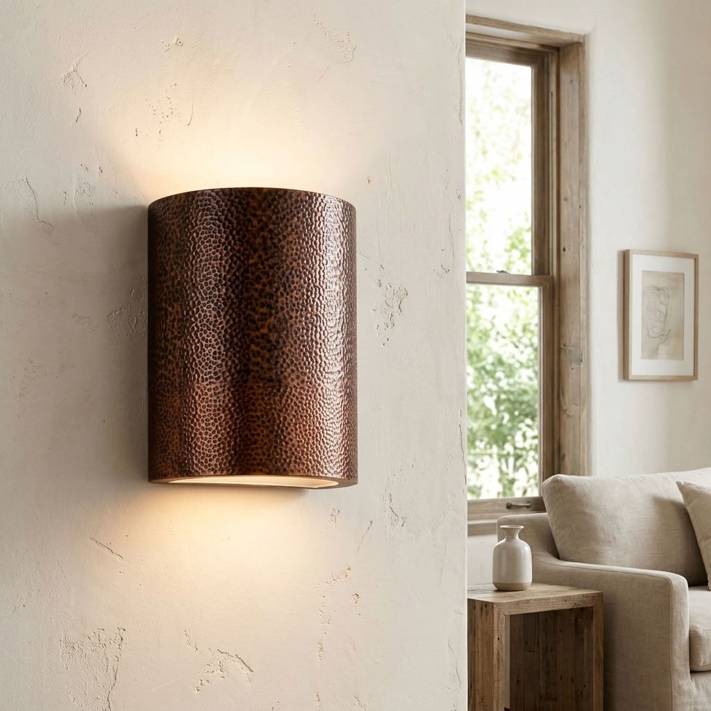 Hammered copper cylinder wall sconce with warm up and down lighting — view 3