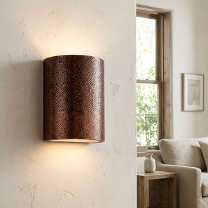Hammered copper cylinder wall sconce with warm up and down lighting — view 3