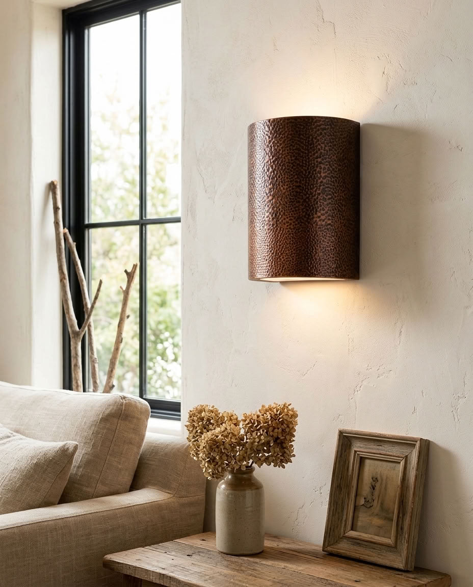 Hammered copper cylinder wall sconce with warm up and down lighting — view 4